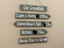 Grandkids sign with names, state maps and mileages. Grand kids directional sign wood on rope